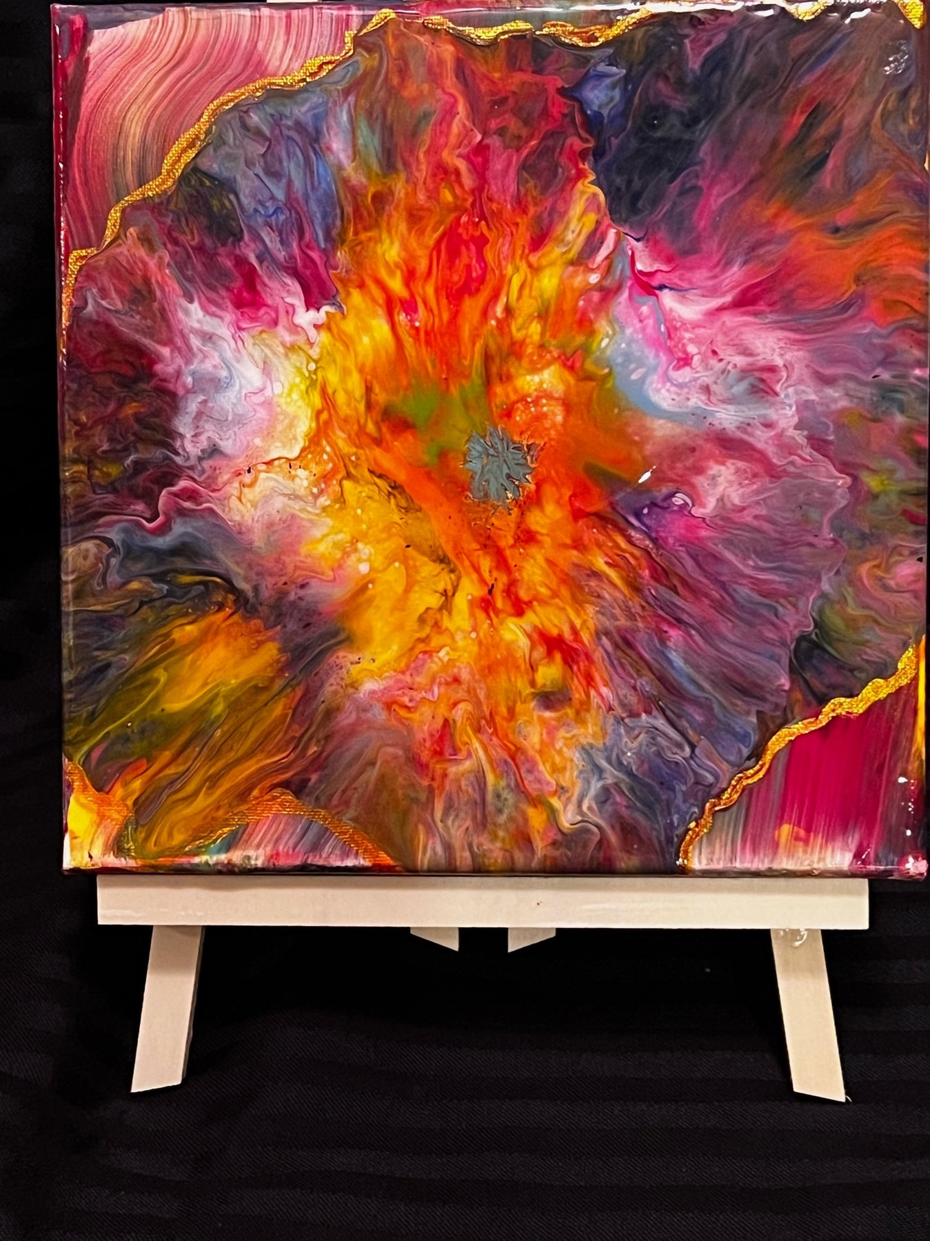 Bright abstract painting on an easel