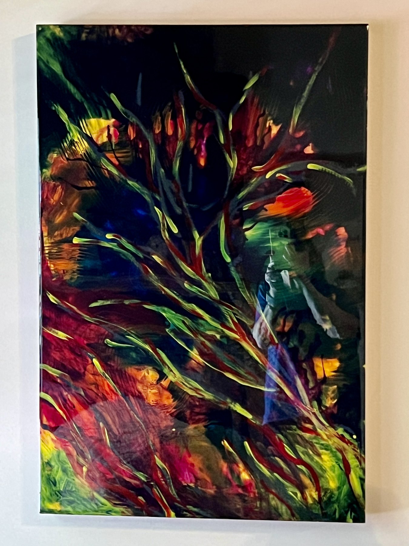 Tall abstract painting displayed on a wall